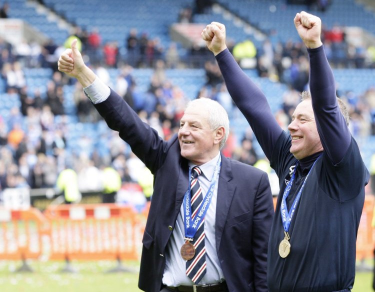 Gerrard and Davis tribute legend in background of title triumph